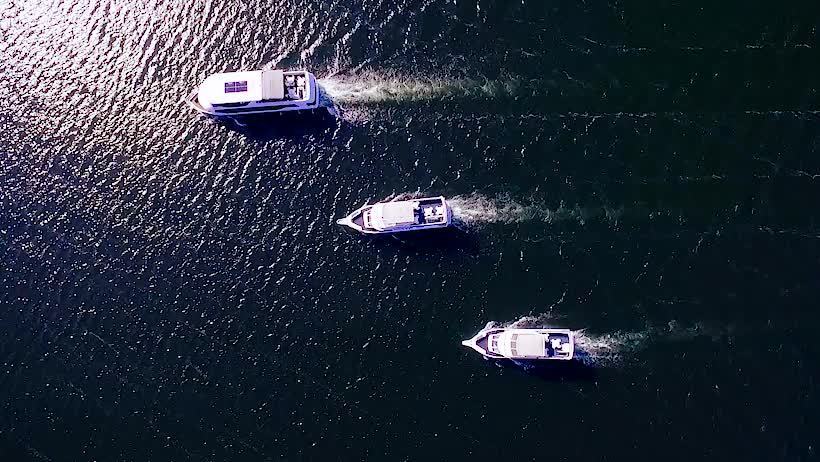 Aerial view of three boats on Mississippi waterways.